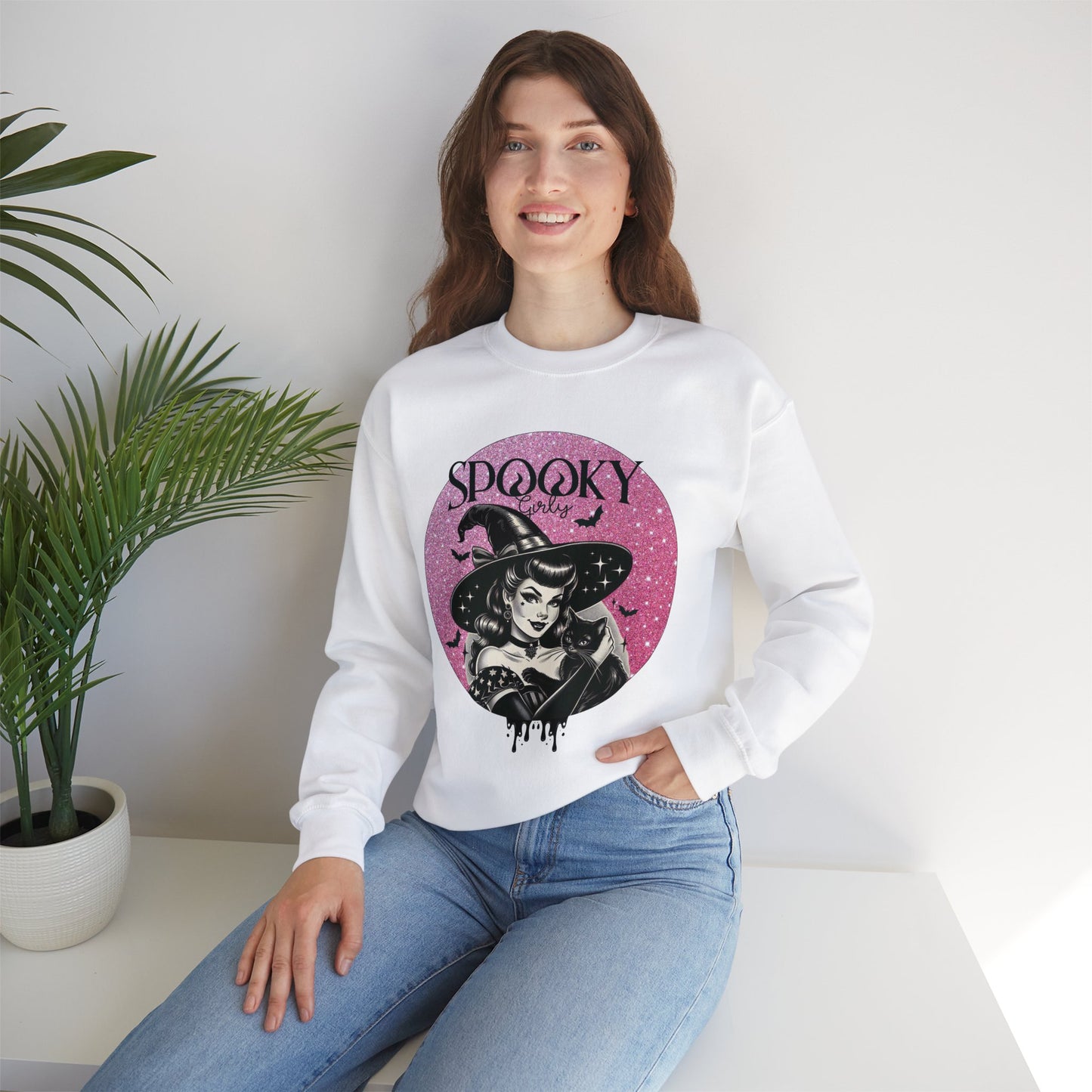 Model is wearing Brand63s Spooky Girls Vintage Witch White Sweatshirt with bats and a black cat